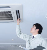 Inspector examining plumbing system in a residential home