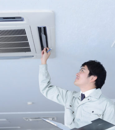 Inspector examining plumbing system in a residential home