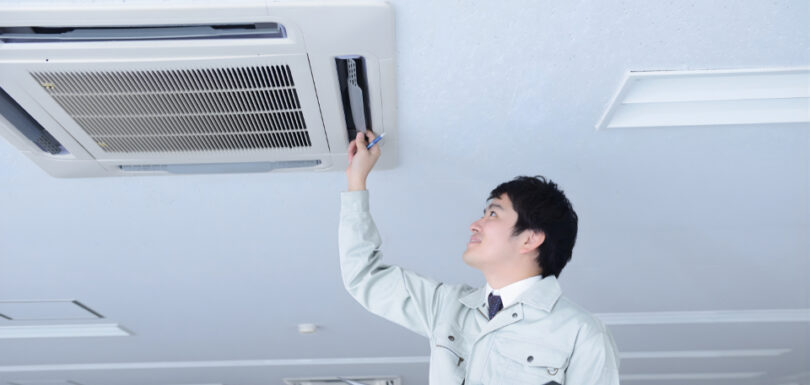Inspector examining plumbing system in a residential home