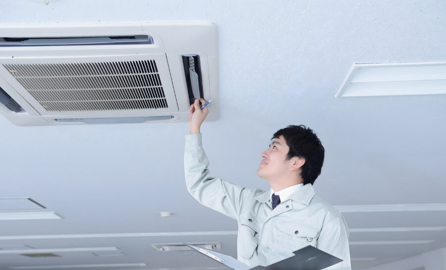 Inspector examining plumbing system in a residential home